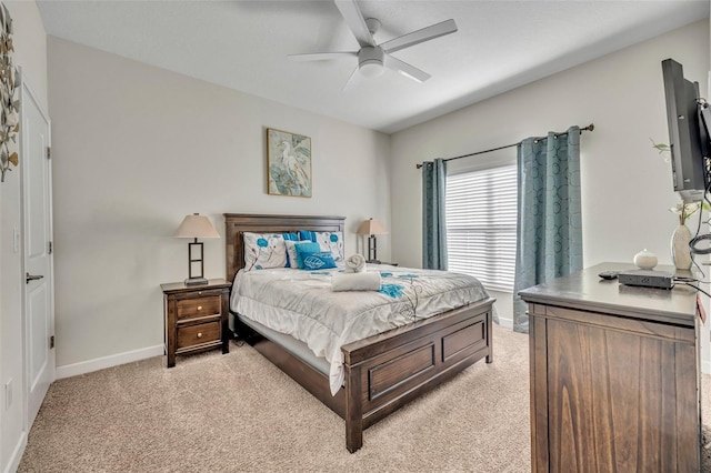 bedroom with light colored carpet and ceiling fan