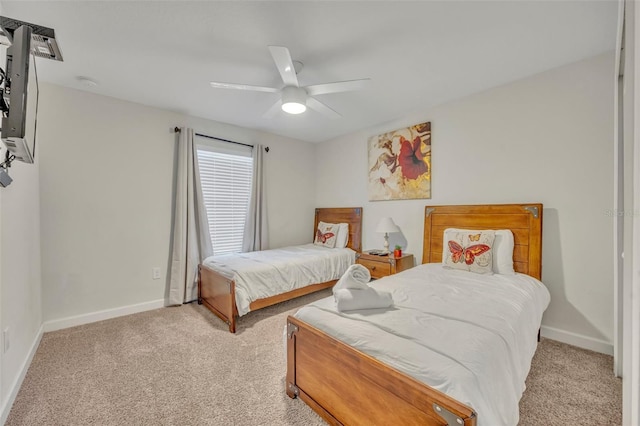 bedroom with light carpet and ceiling fan