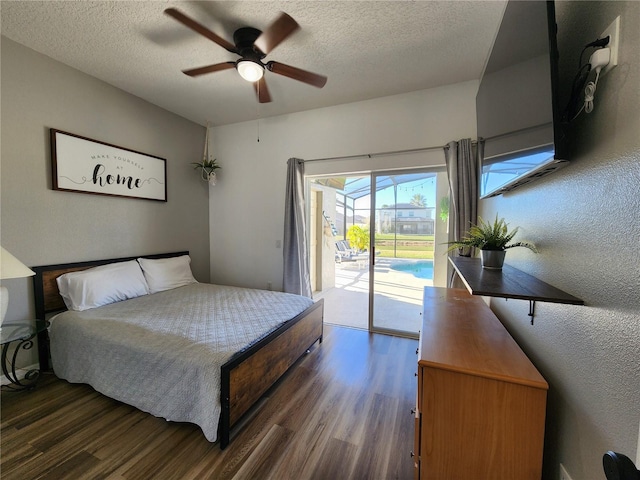 bedroom with a textured ceiling, access to exterior, ceiling fan, and dark hardwood / wood-style floors