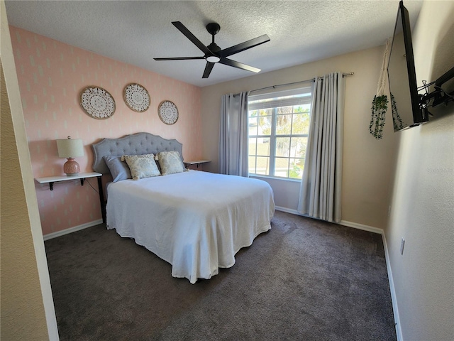 carpeted bedroom with a textured ceiling and ceiling fan