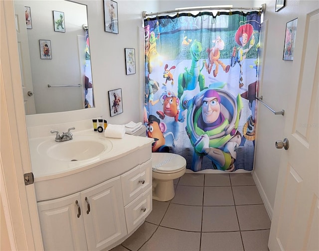 bathroom with tile patterned flooring, vanity, toilet, and a shower with curtain