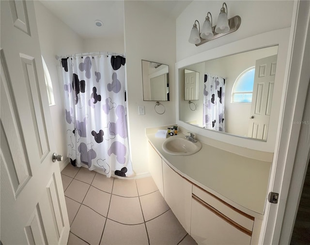 bathroom with tile patterned floors, vanity, and a shower with shower curtain