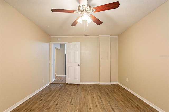 unfurnished bedroom with ceiling fan and hardwood / wood-style floors