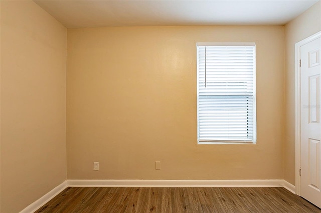 spare room featuring dark hardwood / wood-style floors