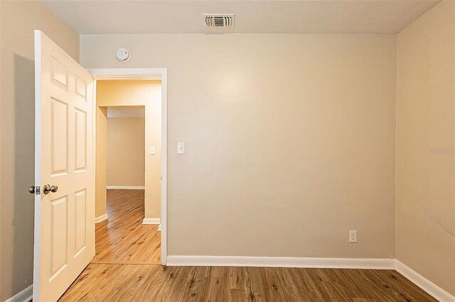 spare room featuring light wood-type flooring