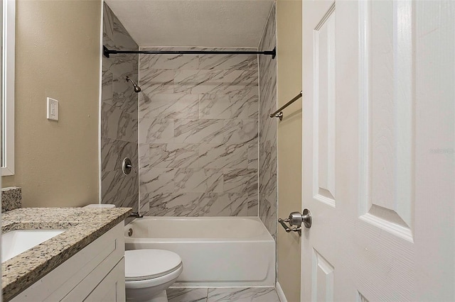 full bathroom featuring vanity, toilet, a textured ceiling, and tiled shower / bath combo