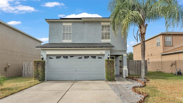 view of front property with a front yard and a garage