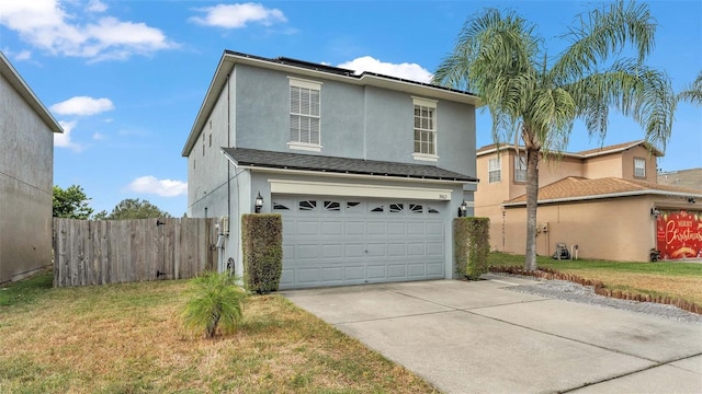 view of front property with a garage and a front yard