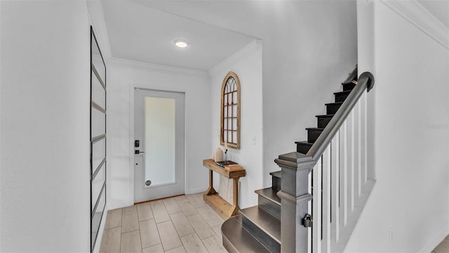 entrance foyer featuring light hardwood / wood-style flooring and ornamental molding