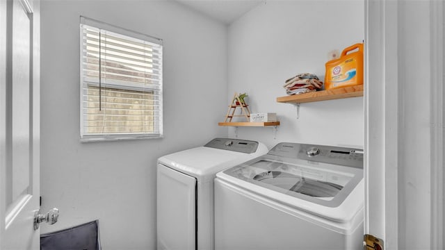 clothes washing area with washer and dryer