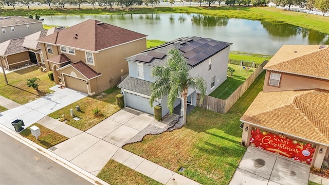 birds eye view of property featuring a water view