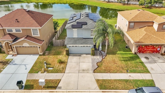 drone / aerial view featuring a water view