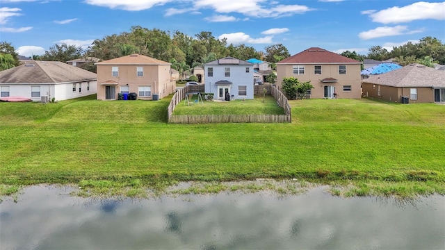 rear view of house with a water view