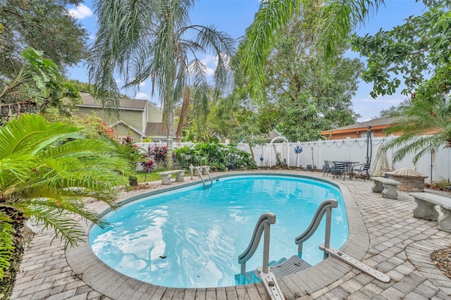 view of pool featuring a patio area