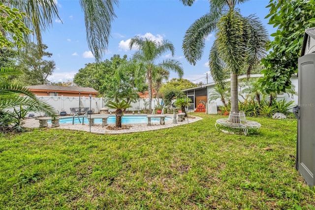 view of yard featuring a fenced in pool