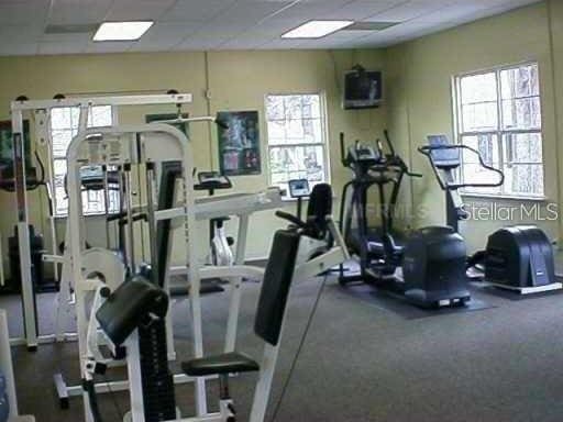 exercise room with a drop ceiling