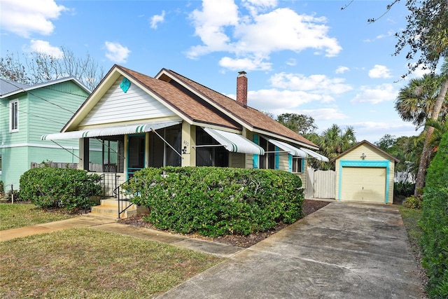 bungalow-style house with an outbuilding and a garage