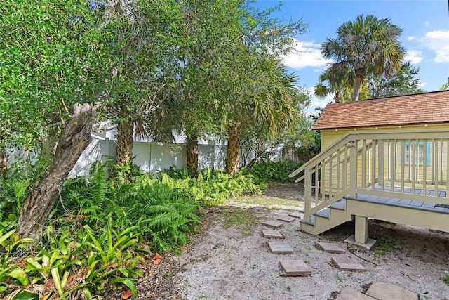 view of yard with a wooden deck