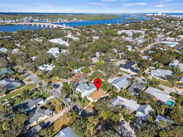 birds eye view of property with a water view