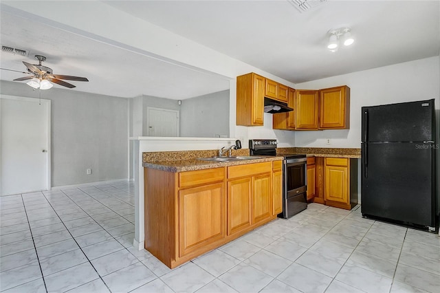 kitchen with ceiling fan, sink, stainless steel electric stove, and black fridge