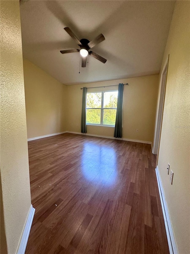 6430 S Goldenrod Rd Unit 15B, Orlando, FL 32822 - spare room with a textured wall, wood finished floors, a ceiling fan, and baseboards