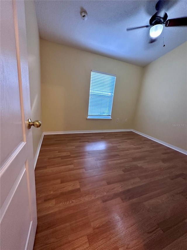 6430 S Goldenrod Rd Unit 15B, Orlando, FL 32822 - empty room with wood finished floors, a ceiling fan, baseboards, and a smoke detector