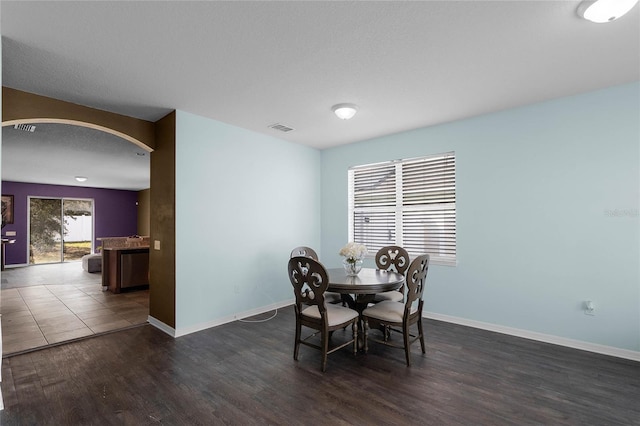 dining room with dark hardwood / wood-style floors