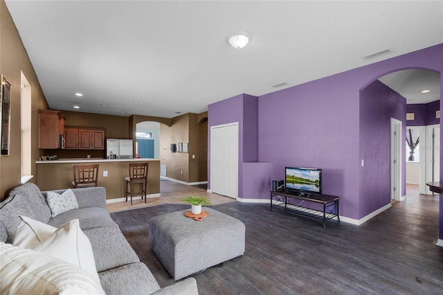 living room with dark hardwood / wood-style floors