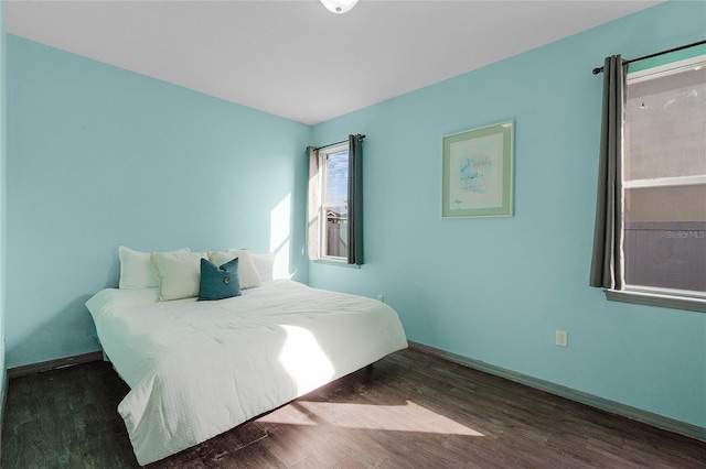 bedroom featuring dark wood-type flooring