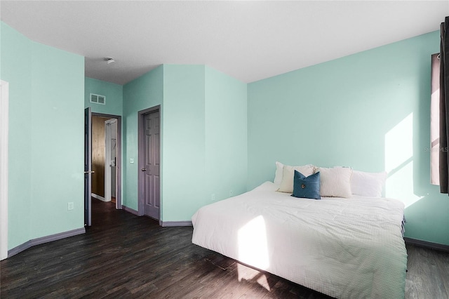 bedroom featuring dark hardwood / wood-style floors