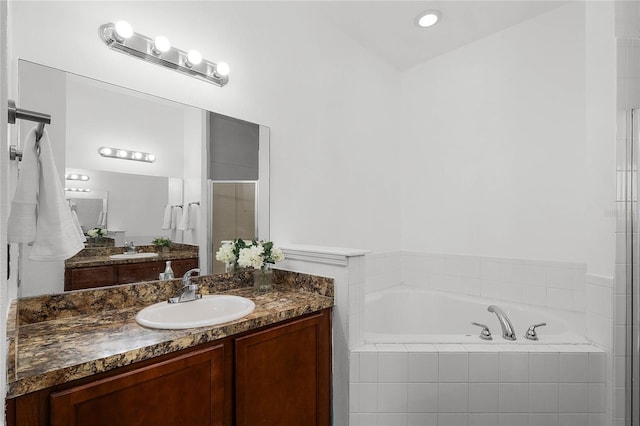 bathroom with vanity and plus walk in shower