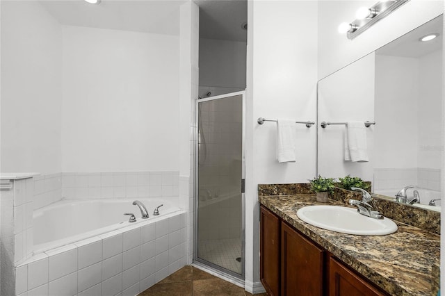 bathroom with vanity, independent shower and bath, and tile patterned flooring