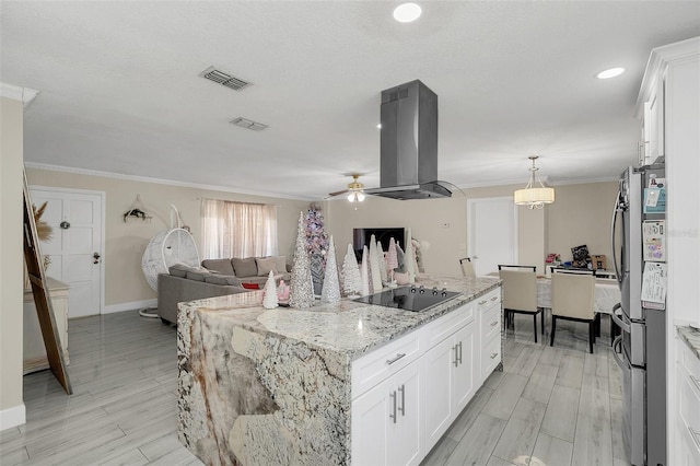 kitchen featuring a center island with sink, stainless steel fridge, white cabinets, and island exhaust hood