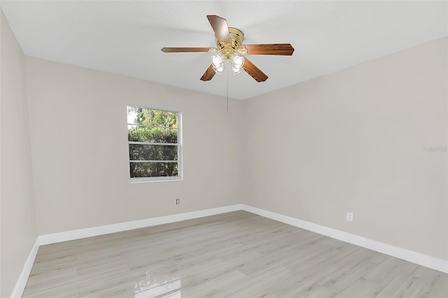 spare room with light hardwood / wood-style floors and ceiling fan