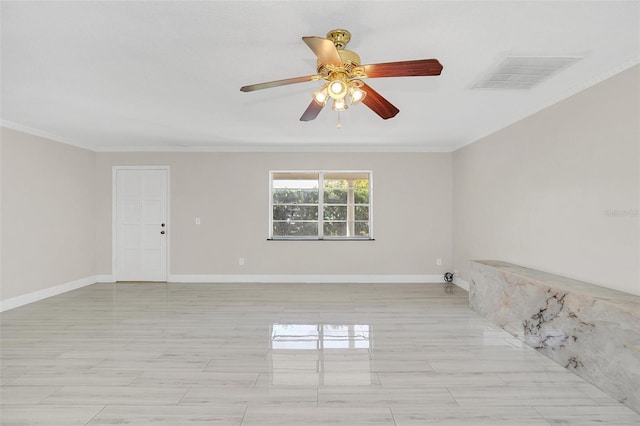 empty room featuring crown molding and ceiling fan