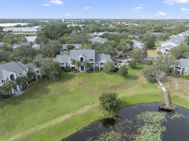 birds eye view of property with a residential view and a water view