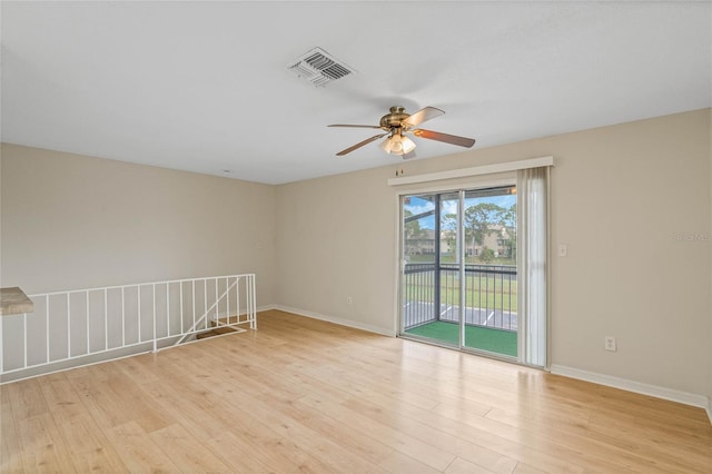 spare room with light hardwood / wood-style floors and ceiling fan