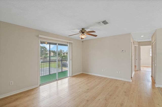 spare room with light hardwood / wood-style floors and ceiling fan