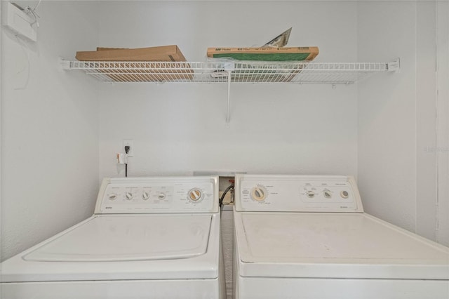 washroom featuring washer and dryer