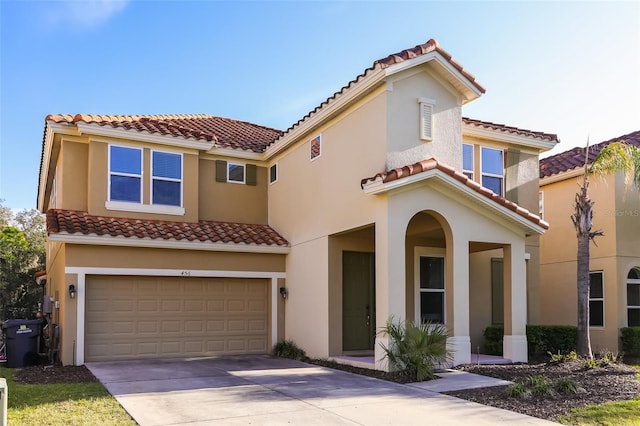 mediterranean / spanish-style home featuring a garage