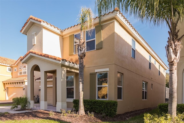 view of property exterior featuring a garage