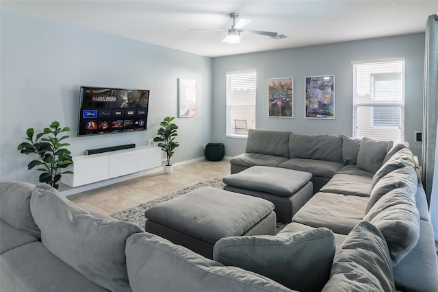 living room with ceiling fan and light tile patterned floors