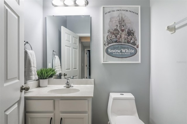 bathroom with vanity and toilet