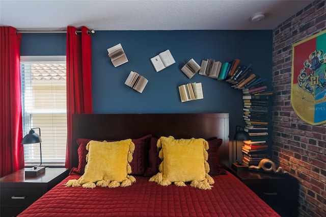 bedroom with brick wall