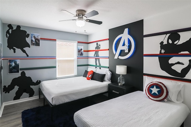 bedroom with ceiling fan and hardwood / wood-style flooring