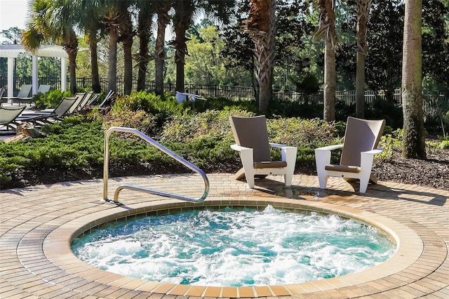 view of pool with a community hot tub