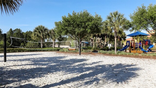 view of home's community featuring volleyball court and a playground