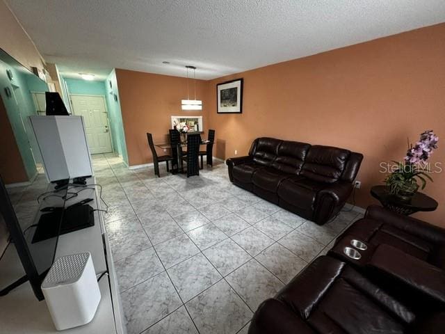 living room with a textured ceiling