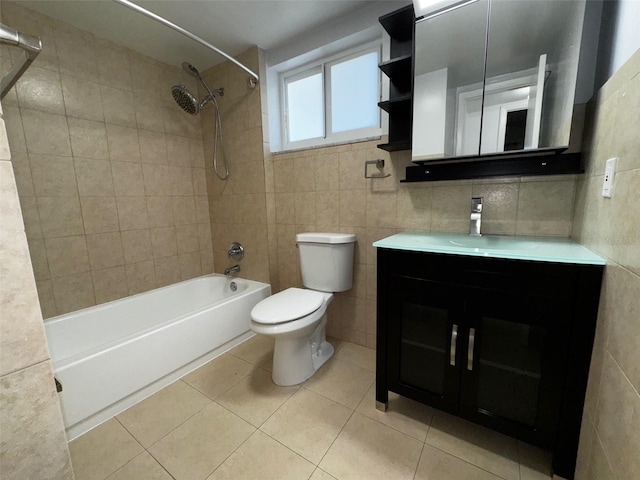 full bath featuring shower / bath combination, tile patterned flooring, toilet, and tile walls