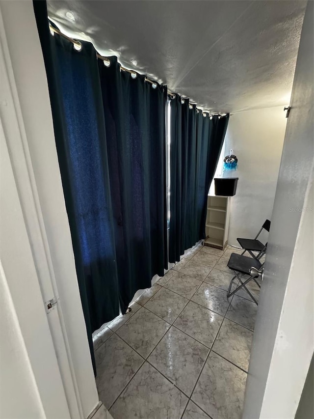 bathroom with tile patterned floors